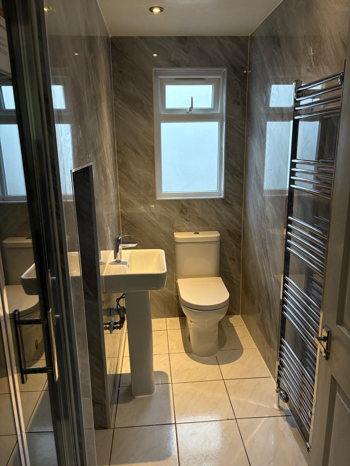 The same cloakroom after full renovation by Jurassic Bathrooms