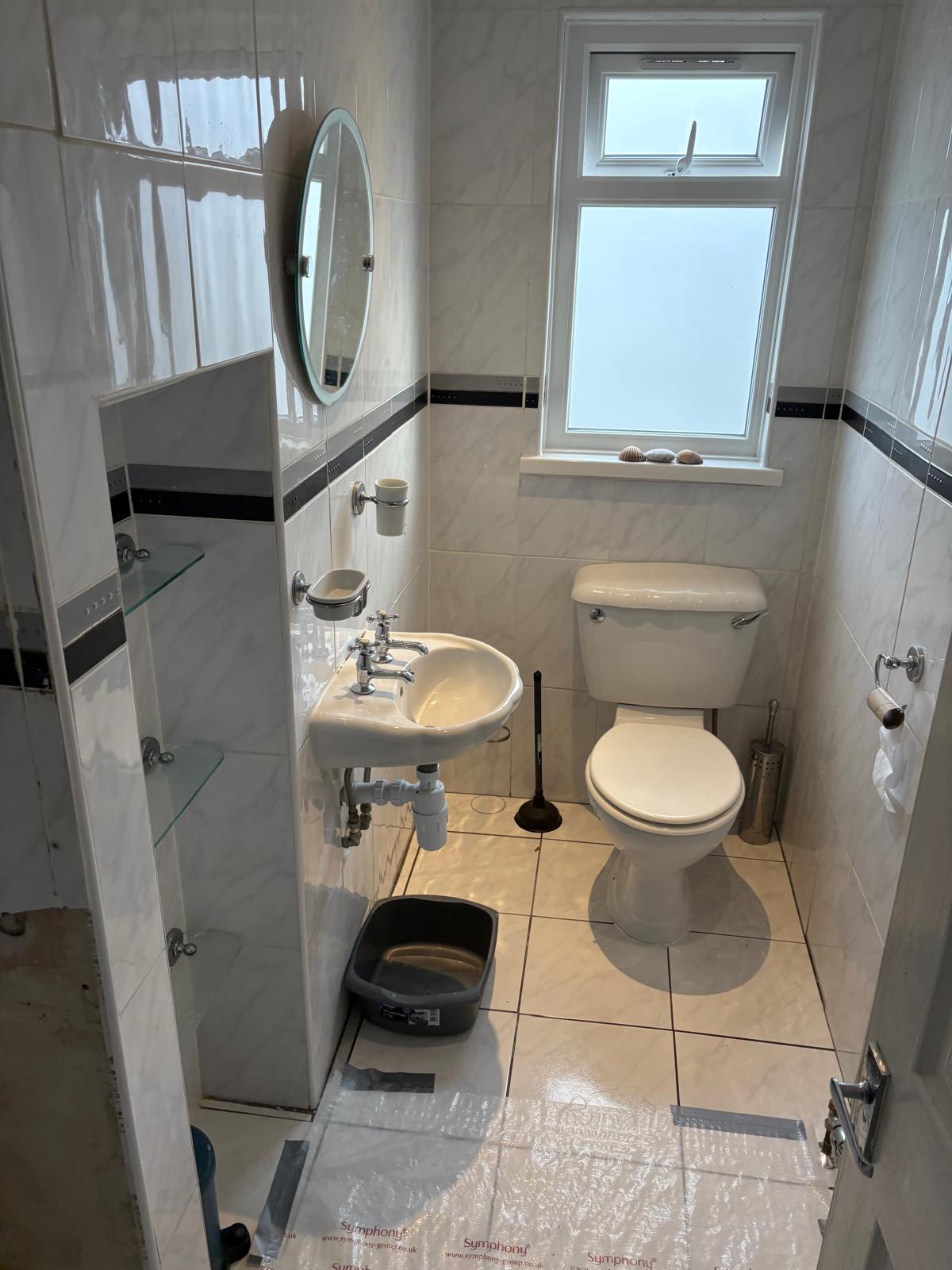 Dated cloakroom before renovation